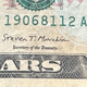 Photo of Steven Mnuchin's signature on a 10 dollar bill.